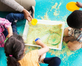 Children playing around a sandpit